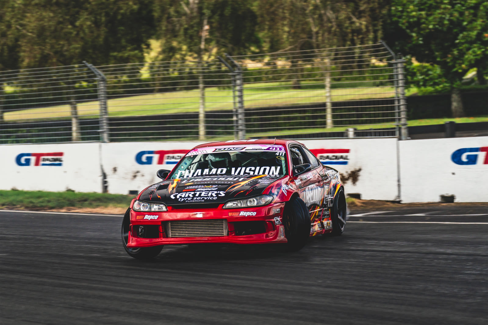 A drift car past GT Radial branding