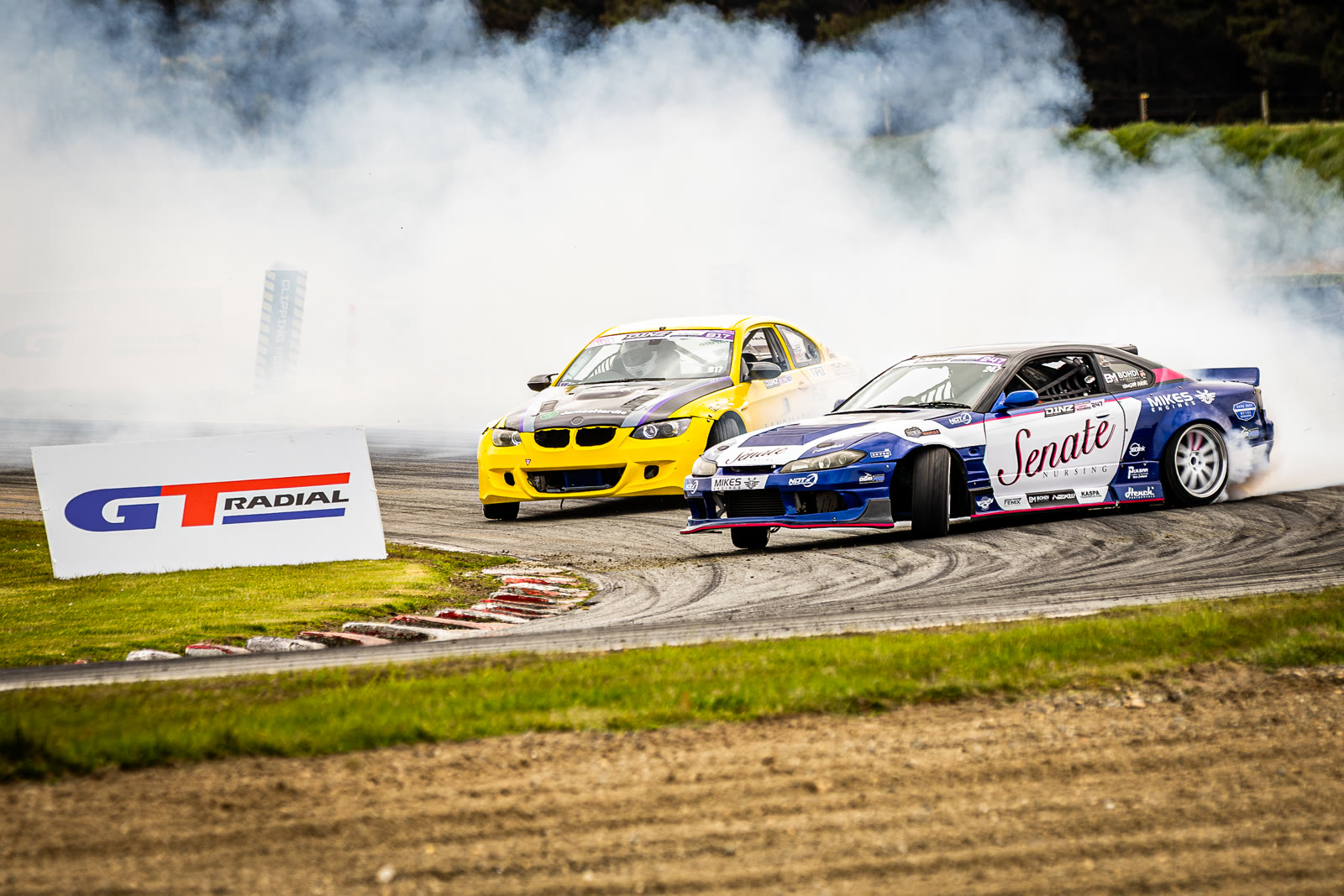 Tandem drift battle past the GT Radial banner