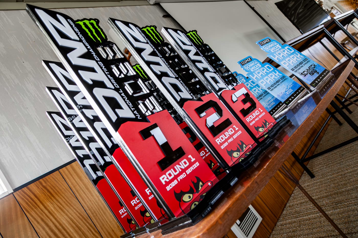 A row of D1NZ Pro Series trophies ready for the podium