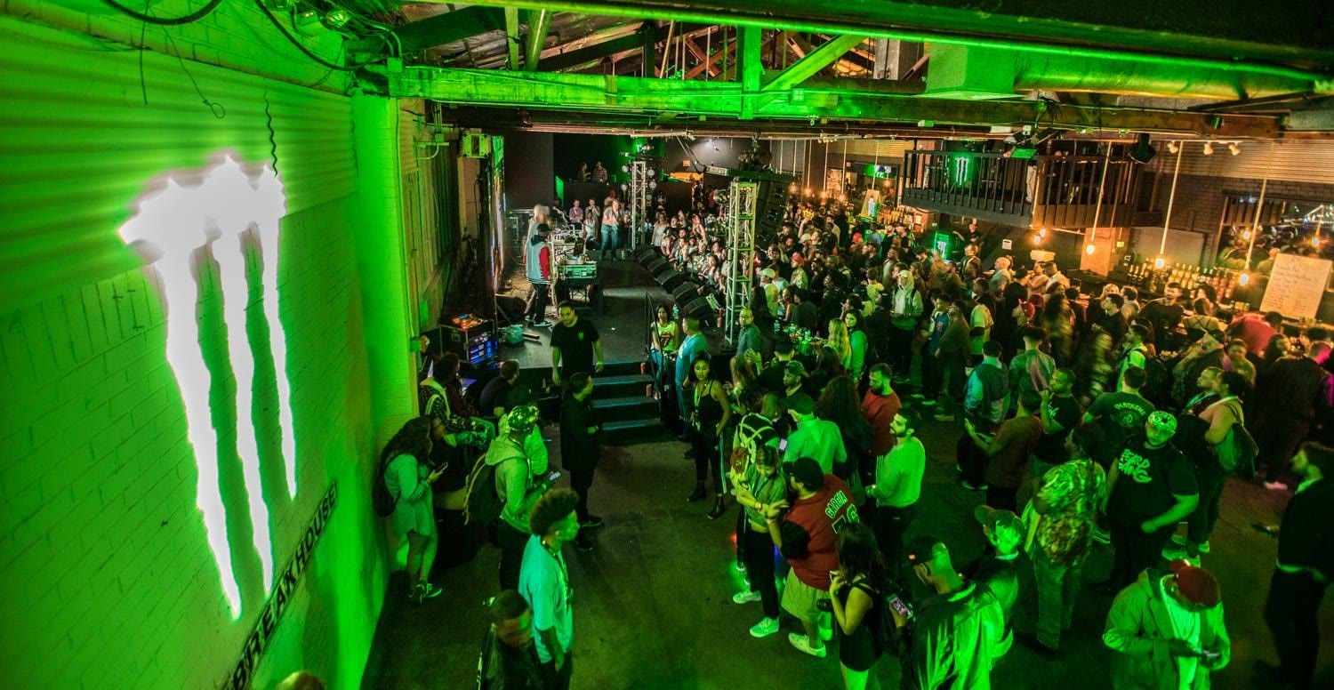 Monster Energy green-lit activation zone full of fans